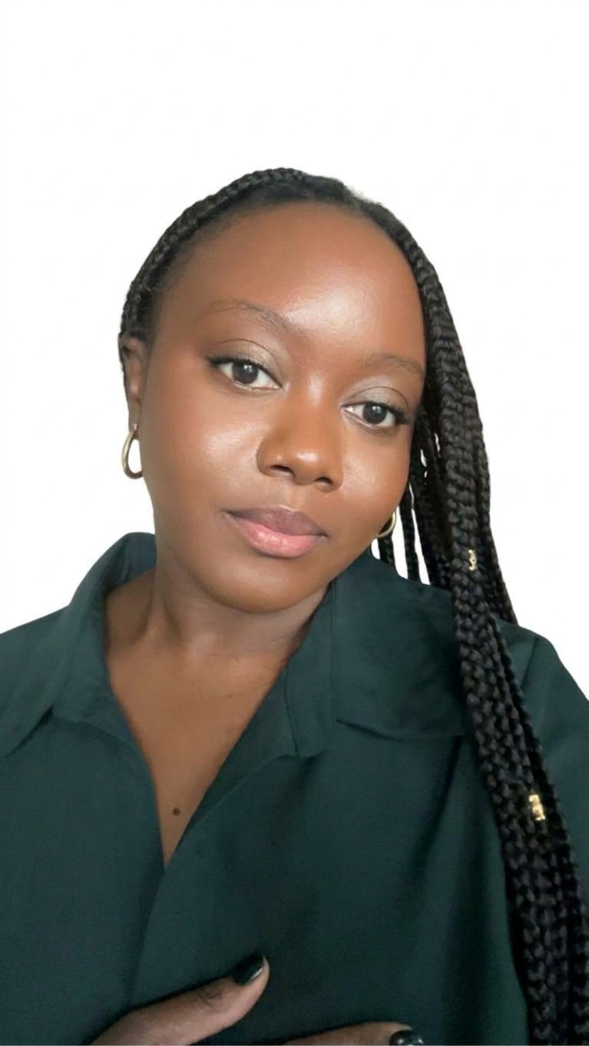 Joneal, founder of The Coily Company, wearing long braids